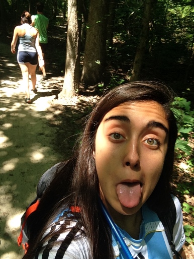 Cute selfie with the couple walking through the woods